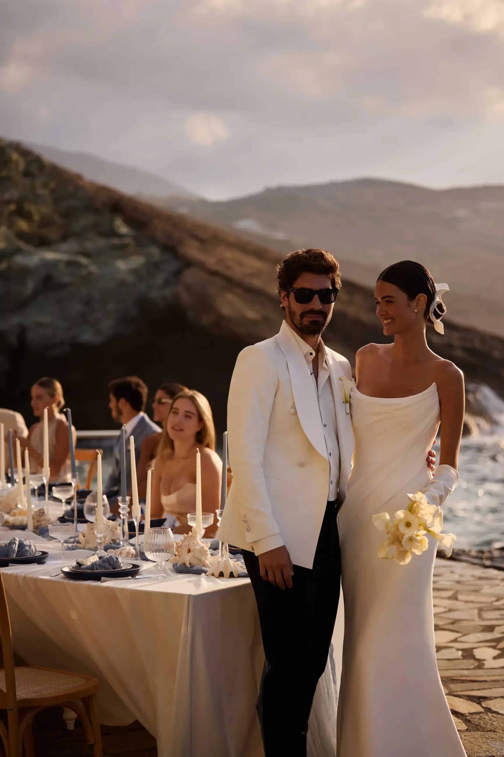 model is wearing a chiffon fitted wedding dress with detachable sleeves