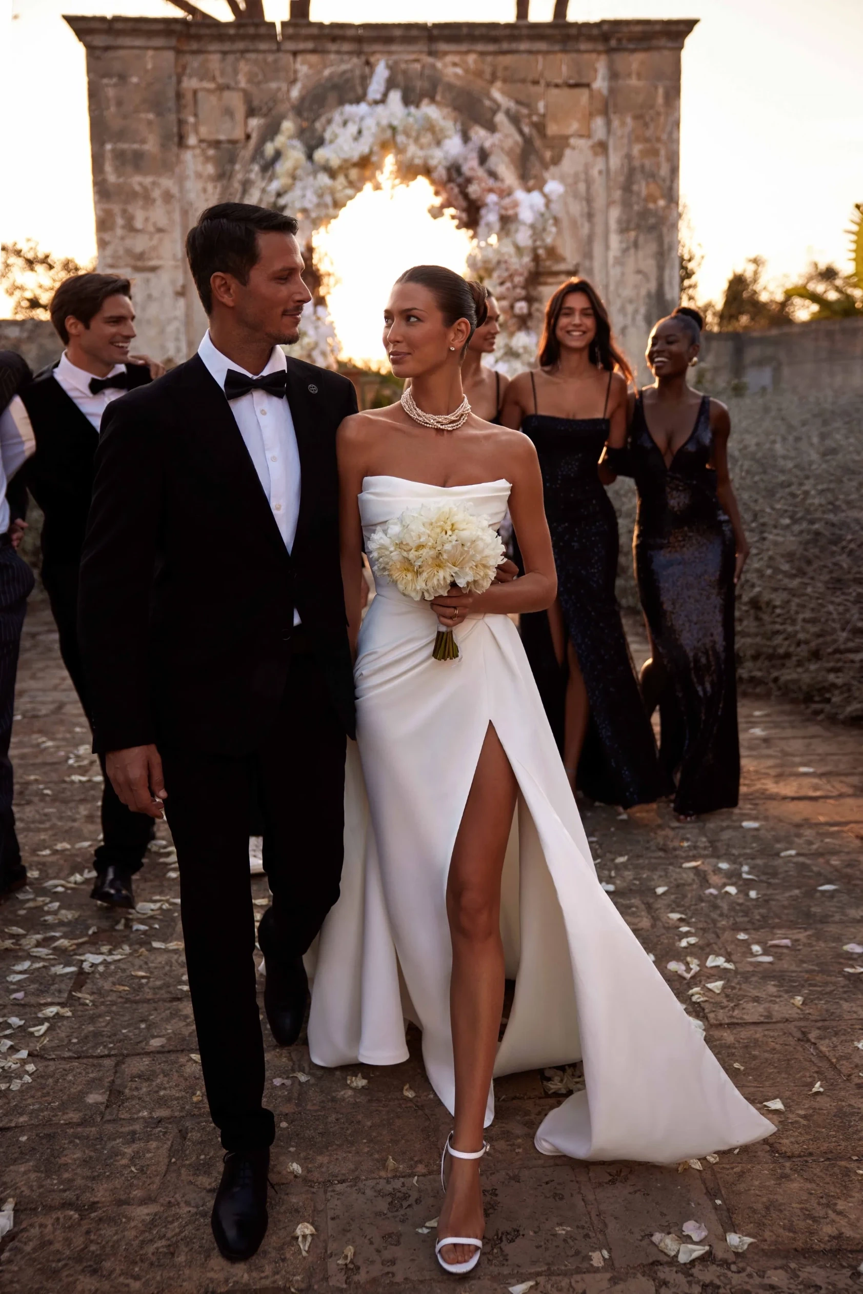 strapless satin wedding gown with thigh-high slit and fitted silhouette