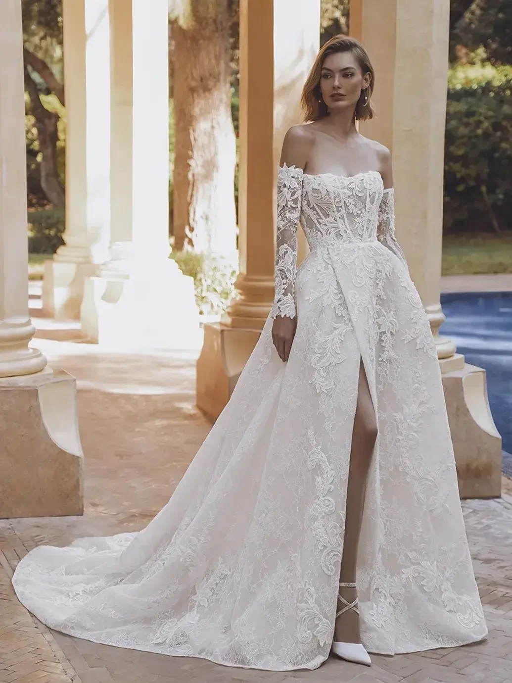 model is wearing a strapless ball gown wedding dress